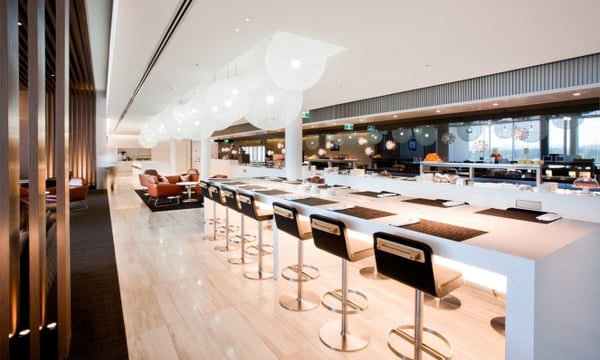 The very posh Qantas Canberra lounge features plenty of light, warmth, texture, and modern amenities.