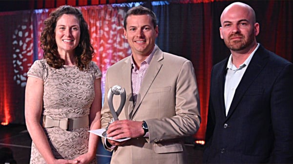 InteliSys President Wayne Chamberlain accepting an award.